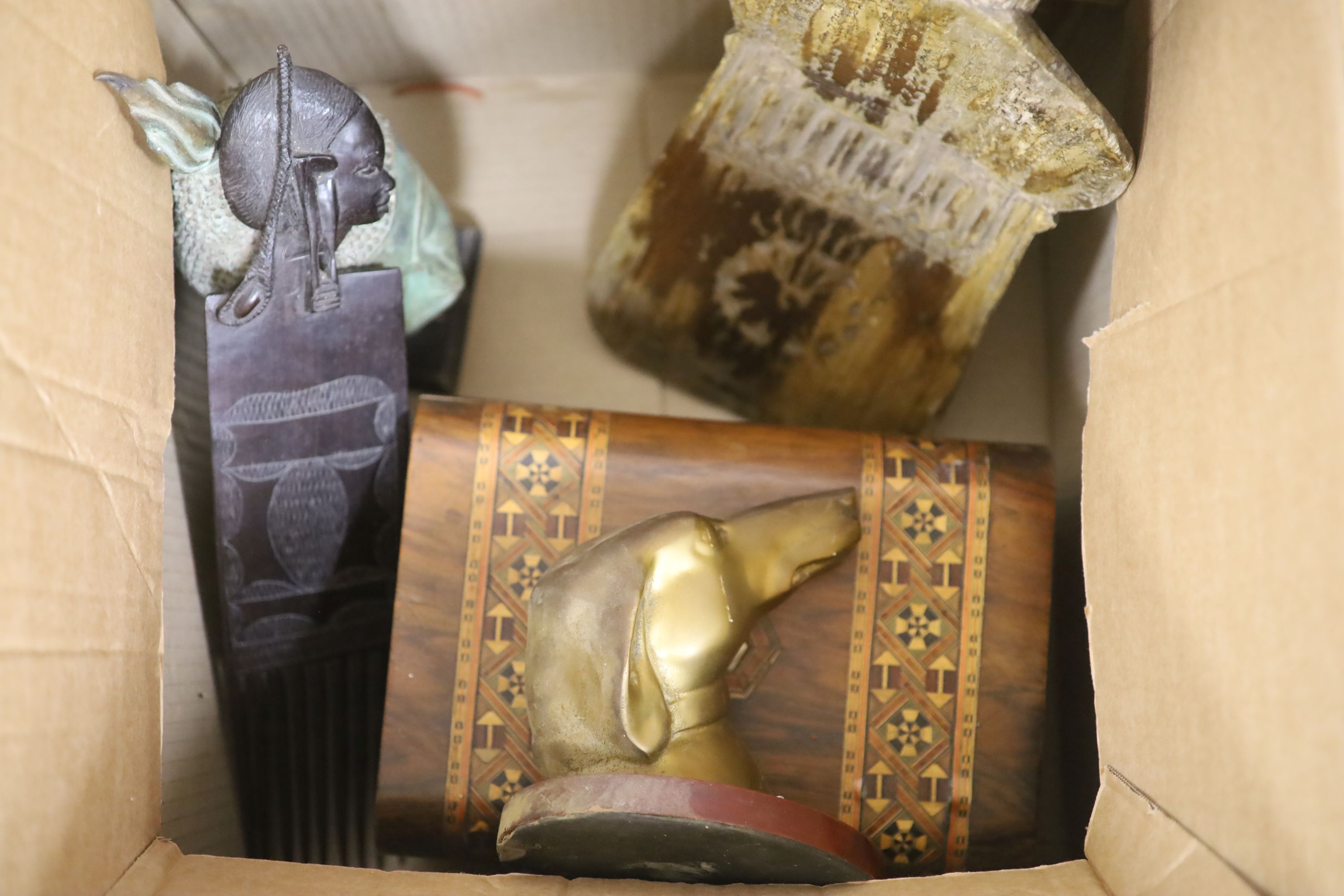 A quantity of mixed collectables including a grain shovel, a Buddha head, an African carved wood comb etc.